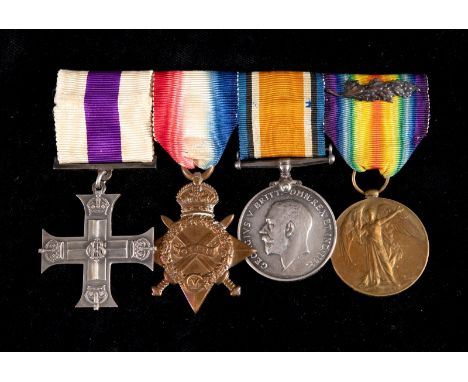 A group of four medals, awarded to Capt H J Minniken, West India Regiment, comprising an MC (privately named and dated August