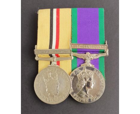 A pair of medals, awarded to 25119499 Gdsn M A Lasisi IG, comprising an Iraq medal, with 18 Mar to 28 Apri 2003 clasp, and a 