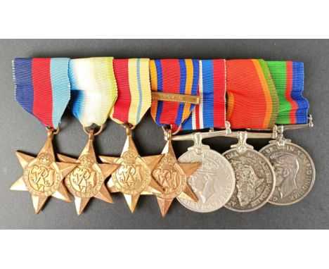 A group of seven medals, awarded to 68162 A M Stephens, comprising a 1939-1945 Star, Atlantic Star, Africa Star, Burma Star w