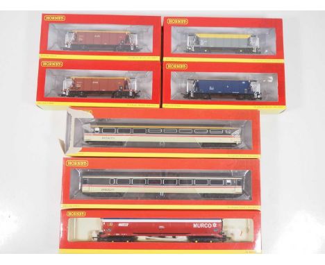 A group of HORNBY OO gauge rolling stock comprising various Seacow hopper wagons, a 100 ton tank wagon and a pair of Mk3 coac