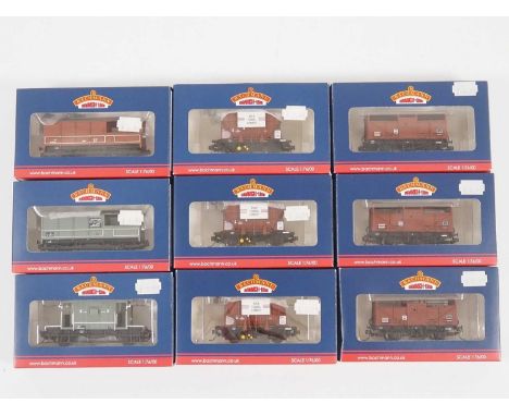 A group of BACHMANN OO gauge wagons comprising cattle and cement examples together with brake vans, all fitted with Kadee cou