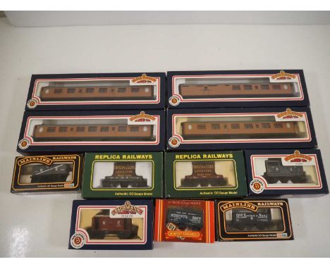 A mixed group of OO gauge rolling stock by BACHMANN, REPLICA and others to include coaches and wagons - VG in G/VG boxes (11)