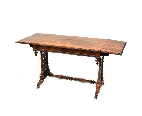 Victorian rosewood sofa table, rectangular top with two drop leaves, beaded edge, turned columns with fretted panels, turned 