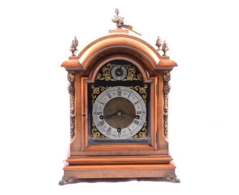 German walnut bracket clock, 20th Century, domes case with flame finials, corner caryarids and grille sides, scrolled feet, 1