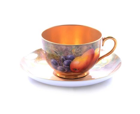 Royal Worcester matched teacup and saucer, fruit painted, comprising a cup, hand painted with pears and grapes, signed P Love