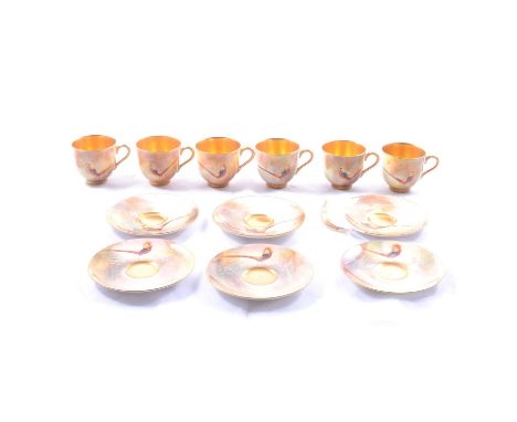 Set of six Royal Worcester coffee cans and saucers by Walter Sedgley, dated 1922-1923, painted with Golden Pheasants in lands
