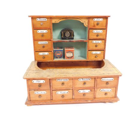 A Victorian pine apprentice shop display cabinet, the upper section with eight drawers flanking two recesses, the extended co