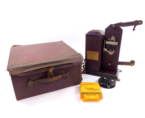 A Kodatoy Universal Model 16mm film projector, cased.