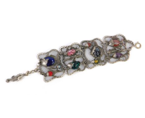 A contemporary four link bracelet, white metal and coloured art glass, cast as open panels of fish, on a bolt ring clasp with