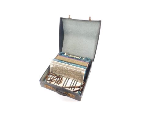 An Alvari 20thC piano accordion, 24 button cased.