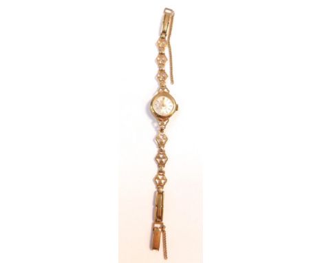 A Rotary lady's 9ct gold circular cased wristwatch, silvered dial with gold batons, on a 9ct gold fancy link bracelet, with c