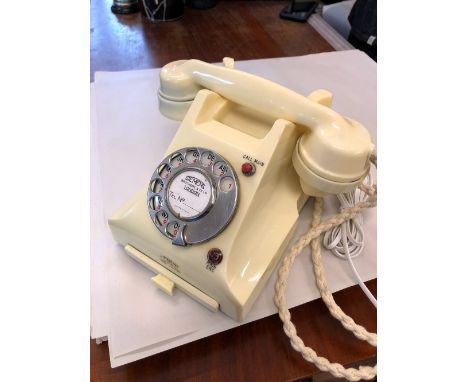 A circa 1950's ivory bakelite Siemen's Art Deco pyramid style telephone, with in out switch to reverse, red call name button 