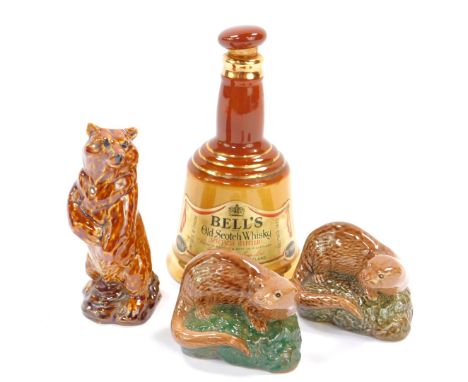 Three Beswick Beneagles Scotch Whisky decanters, comprising a brown bear and two otters, each 50ml, together with a Bells Sco