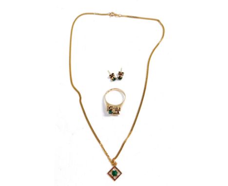 A 9ct gold and emerald ring, in an abstract design, size R, together with a 9ct gold and emerald pendant, on a curb link chai