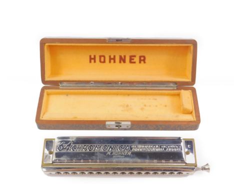 A Hohner Chromonica, The Sixty Four, four chromatic octaves professional model, cased.