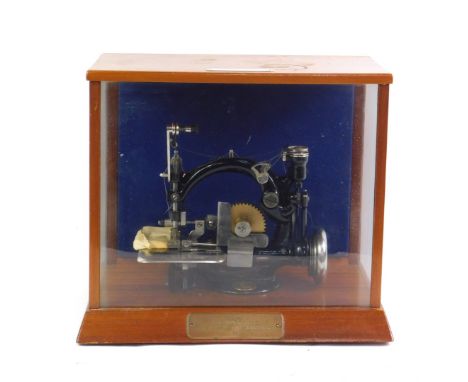 A Willcox &amp; Gibbs shell picot chain stitch sewing machine, c1910, with lay-in cord, break spun polyester/Vincel interlock