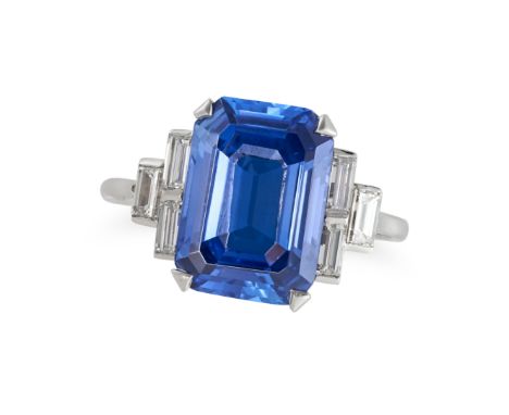 A CEYLON NO HEAT SAPPHIRE AND DIAMOND RING in platinum, set with an octagonal step cut sapphire of 5.75 carats, the stepped s