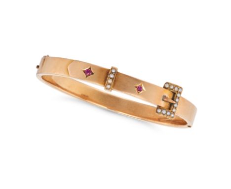 AN ANTIQUE RUBY AND PEARL BELT BANGLE in yellow gold, designed as a belt set with cushion cut rubies and pearls, no assay mar
