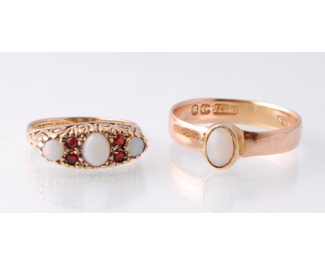 Two hallmarked 9ct gold and opal rings. The first ring set with an opal cabochon within a yellow gold &nbsp;bezel setting hav