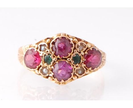 An 18ct Georgian emerald, half pearl tourmaline and garnet ring. Chased shoulders with scroll worked filigree mount.&nbsp; To