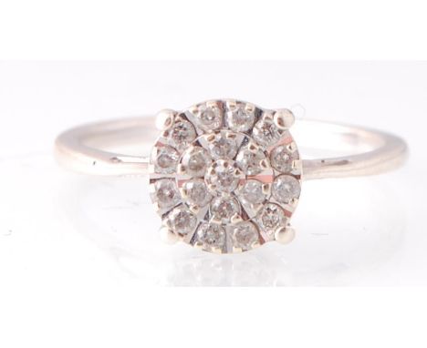 A 9ct white gold and diamond cluster ring. The cluster with inset 0.25pnts estimated diamond weight. Total weight&nbsp; 1.91g
