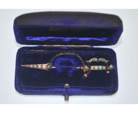 A stunning 9ct gold jabot brooch pin in the form of a sword having the handle hilt and tip set with&nbsp;opal cabochons. Stam