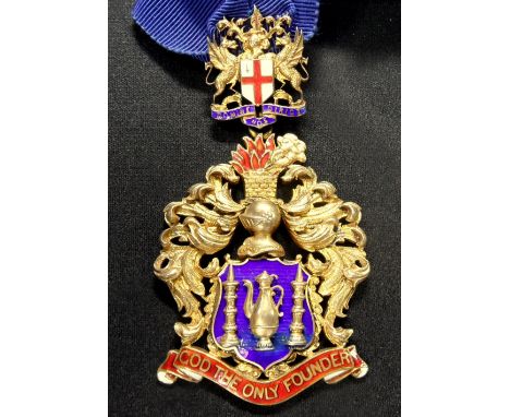 A silver gilt and enamel neck badge of The Worshipful Company of Founders, by Spencer, Birmingham 1924, the back engraved 'Pr