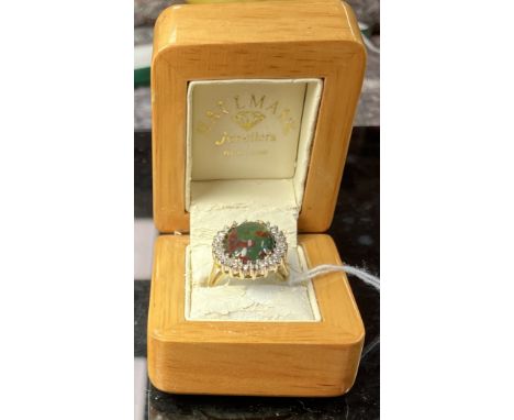 A 9 carat gold dress ring set with oval cabouchon blood stone, size N, 9.4 g over all