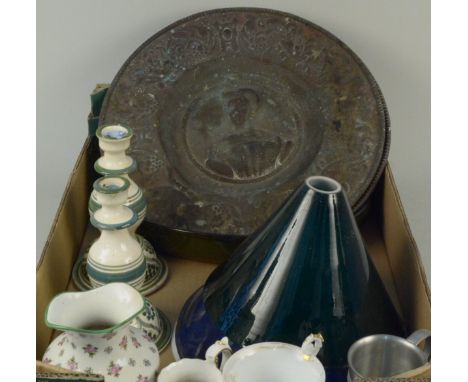 A mixed lot including two enamel and one green glass lamp shades, two embossed brass wall plaques, candlesticks, jugs etc
