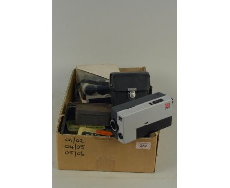A boxed (untested) Polaroid Autofucus 3500 Land camera together with a Kodak Ektanar 13mm lens and a tin of mixed tea cards a