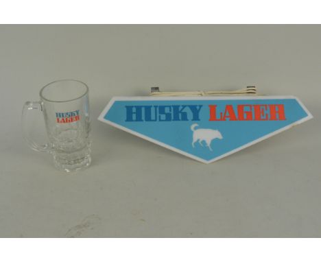 A Husky Lager electric advertising light plus a Husky glass