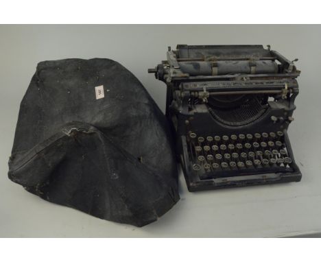 A vintage Underwood typewriter with cover