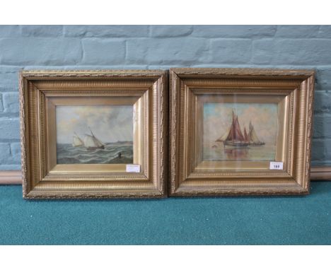 A pair of framed late 19th Century oils of Lowestoft fishing smacks at sea, signed 'C M', 17cm x 22cm