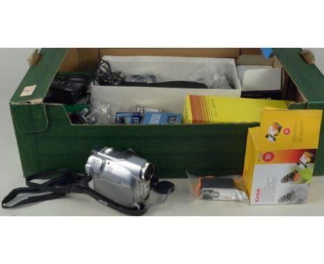 A box of photographic accessories including a Soligor 80-200mm lens, a Cosina 28mm, lens and a JVC digital video camera