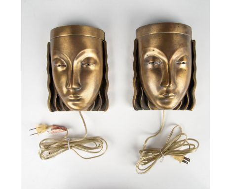 Creative lighting solution with these sconces. Face mask set on bronze ripple back mount. Rotary dial electric cord. Light op