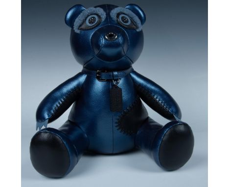 The iridescent blue leather on this handsome guy almost glistens. His big racoon like eyes look right through you with beaded