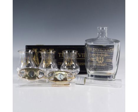 This exceptional set features a collectible bottle marked The Devil's Keep, accompanied by a Devil's Keep logoed box. Also in