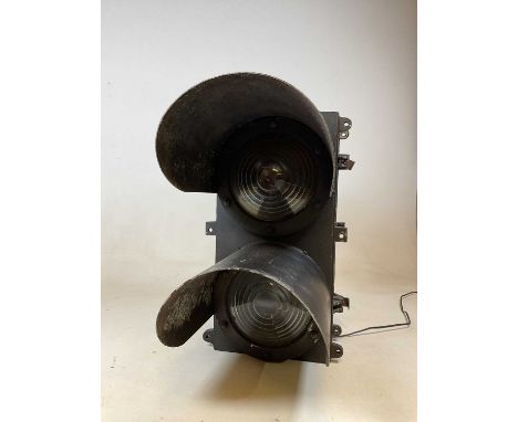A large railway double light with stepped lenses and hood canopies, height 60m.