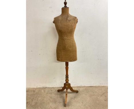 An Edwardian mannequin on pine tripod base, height 165cm approx.