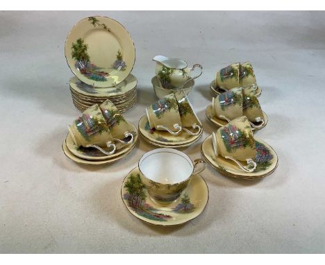 AYNSLEY; a part tea set with twelve tea plates, ten cups and saucers and a jug and sugar bowl decorated in 'Woodland Glade' p