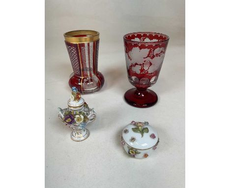 Two 19th century Bohemian ruby flash beakers, one with gilt decoration, the other with grape and vine engraved detail, height