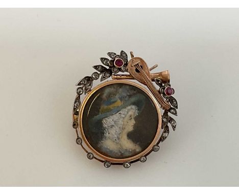 FELIX MENDELSSOHN INTEREST; a yellow metal ruby and diamond brooch centred with a portrait of a woman wearing a hat, beneath 