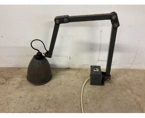 A vintage industrial articulated bracket lamp