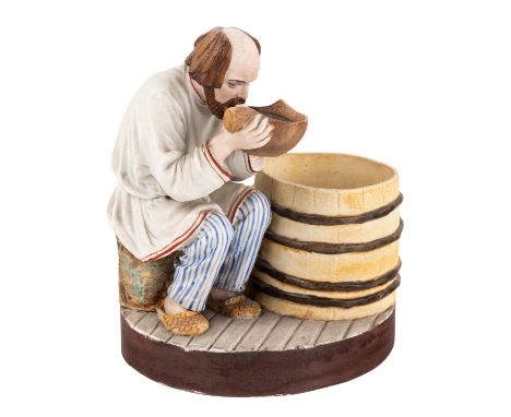 A RUSSIAN PORCELAIN FIGURE OF A MAN DRINKING, POPOV PORCELAIN FACTORY, CIRCA 1850S-1870S realistically modeled peasant sittin