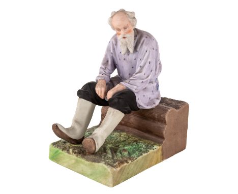 A RUSSIAN PORCELAIN FIGURE OF AN OLD MAN ON A IZBA BENCH, GARDNER PORCELAIN FACTORY, MOSCOW, LATE 19TH CENTURY realistically 