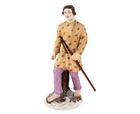 A RUSSIAN PORCELAIN FIGURE OF A YOUNG MAN WITH A WALKING STICK, POPOV PORCELAIN FACTORY, MID-19TH CENTURY naturalistically mo