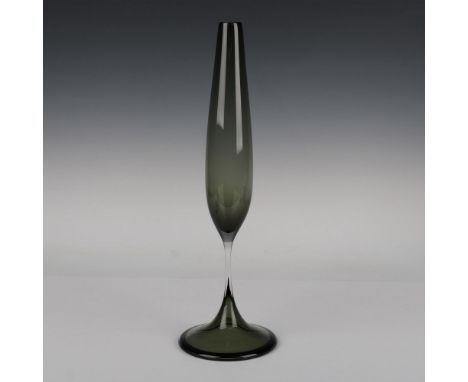 Dark green glass with a flared base and a slender oblong formed top. Orrefors Expo etched on the base. Artist: Nils LandbergI
