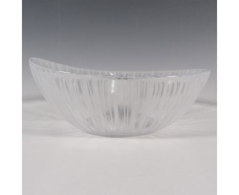 An oval form clear bowl with white vertical streaks. Orrefors stickered on the side, and engraved on the underside. Artist: I