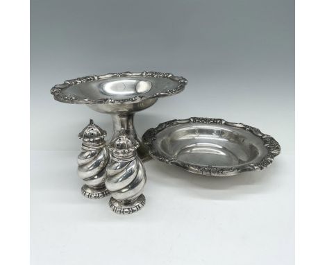 Two exquisite stout salt and pepper shakers featuring a swirled body style crafted by W.B. Mfg. Co. Also included are two pie