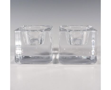 A crystal clear square votive candle holders. Orrefors stickered. This item has its original box: 3"L x 3"W x 3"H. Artist: Go